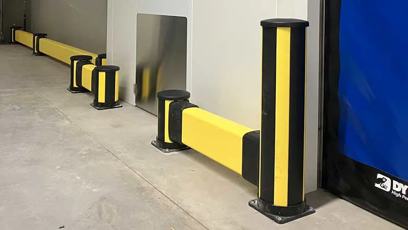 low impact barrier combined with impact bollard protection wall in warehouse environment